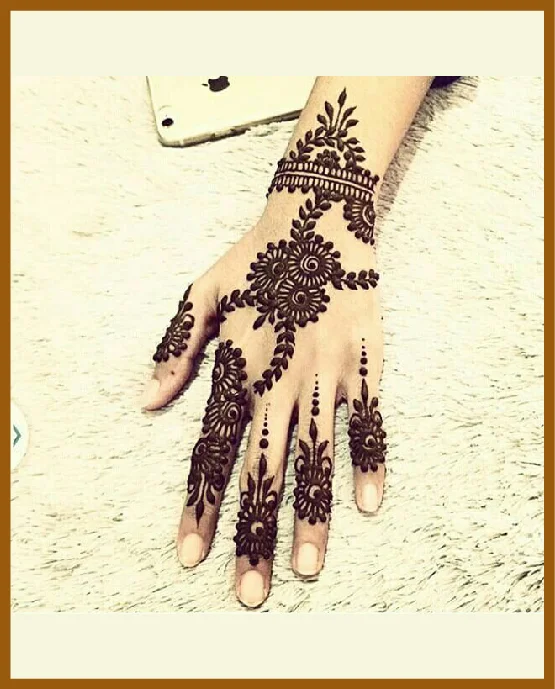 Floral Curls And Chain Trail In Modern Back Hand Mehndi Design